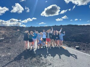 Our class standing by where the road was cut off by the lava