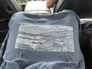 a blue shirt with a printed screen on it